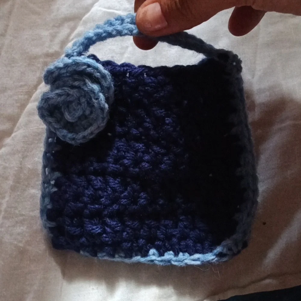 Hand Made Blue Crochet Soap Handbag with Floral Accent And Light Blue Edges